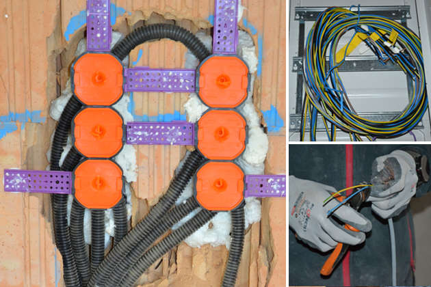 Schalter- und Steckdosen für Elektroinstallation in Ziegelmauerwerk und Drähte für Elektroleitungen